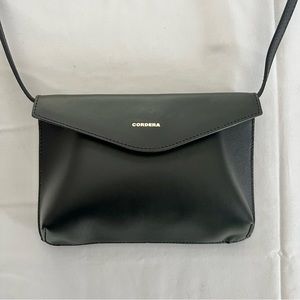 Cordera envelope bag in black